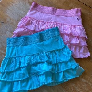 Super cute pink and teal Justice skirts. Size 10. New without tags.